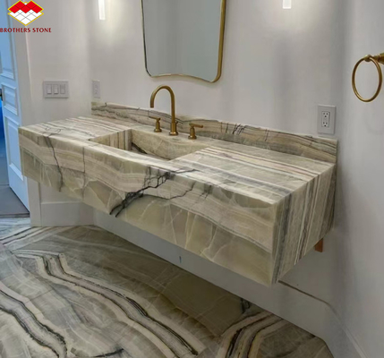 Panel de pared del baño del hotel y lavabo de vanidad con fregadero hecho de piedra natural mármol ónix